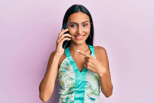 Young Brunette Woman Having Conversation Talking Smartphone Smiling Happy Pointing — Stock Photo, Image
