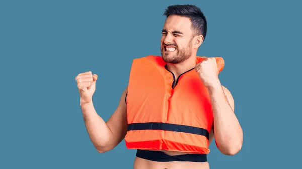 Young Handsome Man Wearing Lifejacket Very Happy Excited Doing Winner — Stock Photo, Image