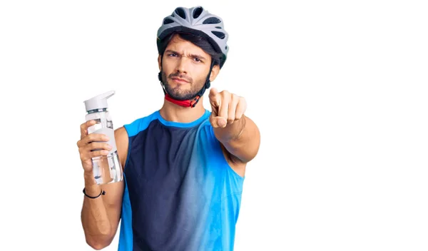 Handsome Hispanic Man Wearing Bike Helmet Holding Water Bottle Pointing — Stock Photo, Image