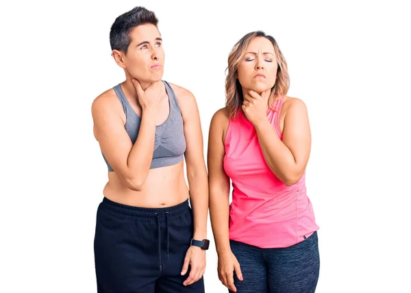 Couple Women Wearing Sportswear Touching Painful Neck Sore Throat Flu — Stock Photo, Image