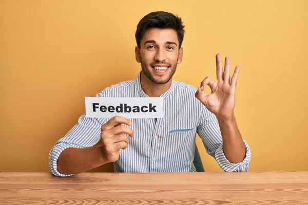 Young Handsome Man Holding Feedback Paper Customer Evaluation Doing Sign — Stock Photo, Image