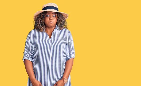 Young African American Size Woman Wearing Summer Hat Puffing Cheeks — Stock Photo, Image