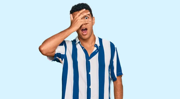 Young Arab Man Wearing Casual Clothes Peeking Shock Covering Face — Stock Photo, Image