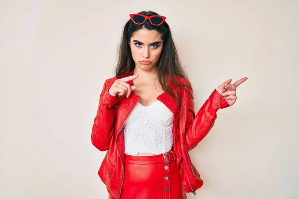 Brunette Teenager Girl Wearing Red Leather Jacket Skeptic Nervous Frowning — Stock Photo, Image