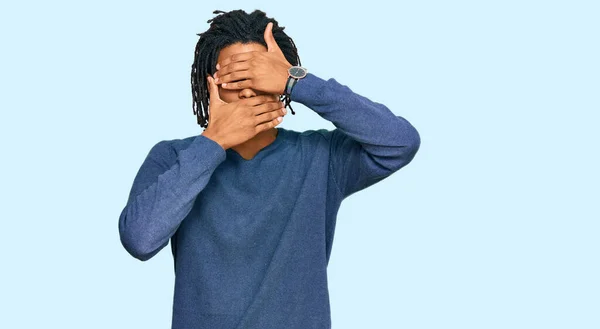 Young African American Man Wearing Casual Winter Sweater Covering Eyes — Stock Photo, Image