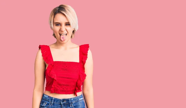 Young Beautiful Blonde Woman Wearing Casual Clothes Sticking Tongue Out — Stock Photo, Image