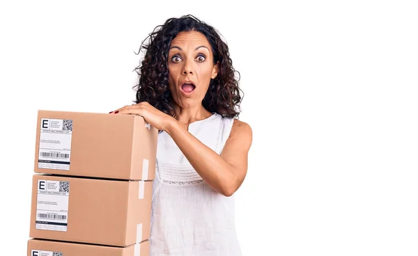 Middle Age Beautiful Woman Holding Delivery Package Scared Amazed Open — Stock Photo, Image