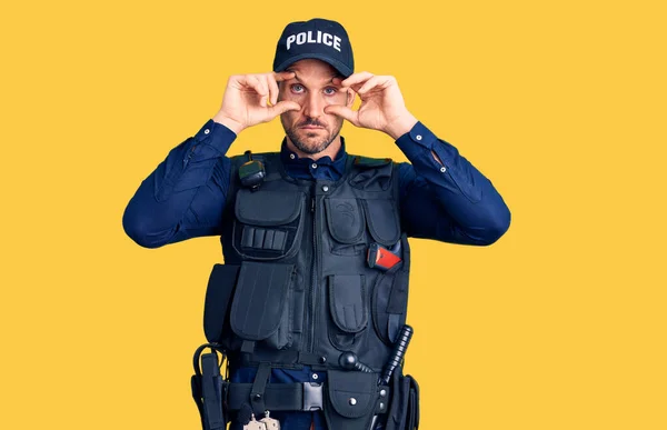 Young Handsome Man Wearing Police Uniform Trying Open Eyes Fingers — Stock Photo, Image
