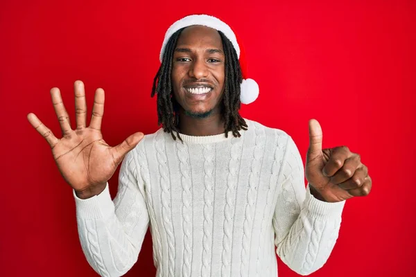 African American Man Braids Wearing Christmas Hat Showing Pointing Fingers — Stock Photo, Image