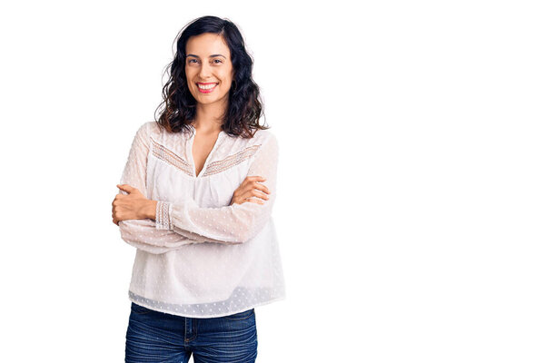 Young beautiful hispanic woman wearing casual clothes happy face smiling with crossed arms looking at the camera. positive person. 