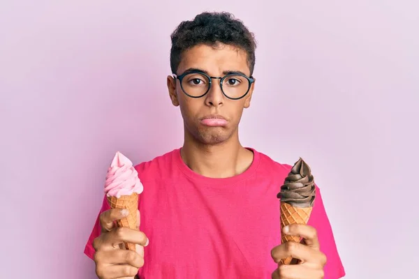 Young Handsome African American Man Holding Ice Cream Cones Depressed — Stock Photo, Image