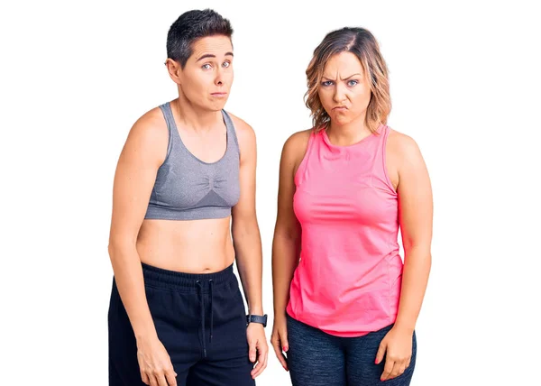Couple Women Wearing Sportswear Skeptic Nervous Frowning Upset Because Problem — Stock Photo, Image