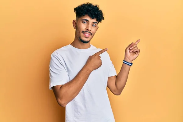 Young Arab Handsome Man Wearing Casual White Tshirt Smiling Looking — Stock Photo, Image