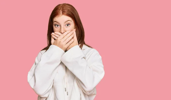 Young Read Head Woman Wearing Casual Sweatshirt Shocked Covering Mouth — Stock Photo, Image