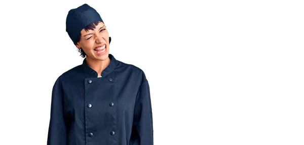 Young Brunette Woman Short Hair Wearing Professional Cook Uniform Winking — Stock Photo, Image