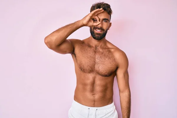 Young Hispanic Man Standing Shirtless Doing Gesture Hand Smiling Eye — Stock Photo, Image