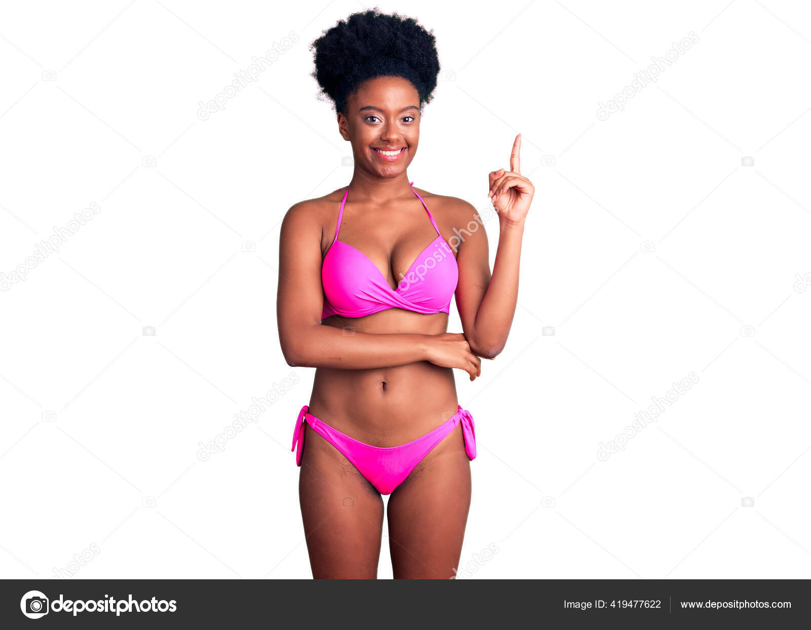 Young African American Woman Wearing Lingerie Using Tape Measure