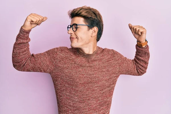 Handsome Caucasian Man Wearing Casual Sweater Glasses Showing Arms Muscles — Stock Photo, Image