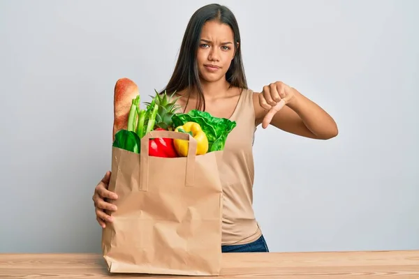 Beautiful Hispanic Woman Holding Paper Bag Bread Groceries Angry Face — Stock Photo, Image