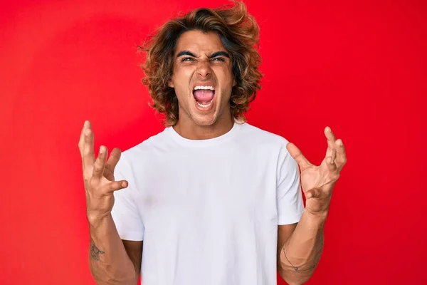 Young Hispanic Man Wearing Casual White Tshirt Crazy Mad Shouting — Stock Photo, Image