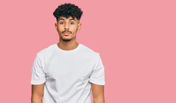 Young Arab Man Wearing Casual White Shirt Relaxed Serious Expression — Stock Photo, Image