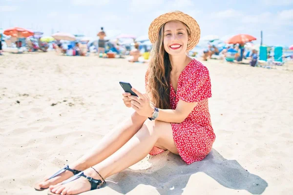 Young Blonde Woman Vacation Using Smartphone Sitting Sand Beach — Stock Photo, Image