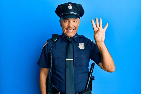 Handsome middle age mature man wearing police uniform showing and pointing up with fingers number four while smiling confident and happy.