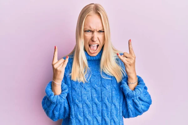 Young Blonde Girl Wearing Wool Winter Sweater Shouting Crazy Expression — Stock Photo, Image