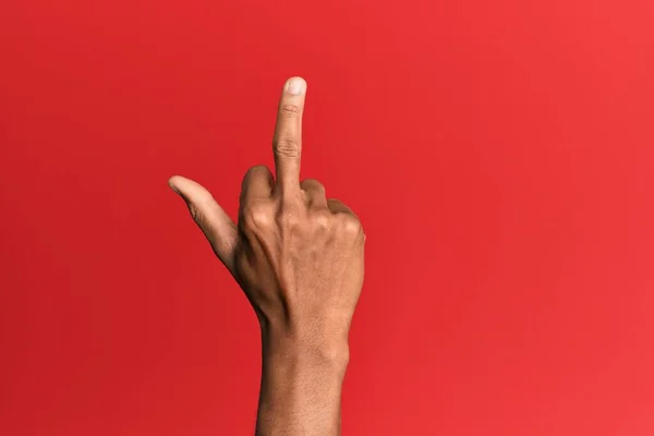 Hand Hispanic Man Red Isolated Background Showing Provocative Rude Gesture — Stok fotoğraf