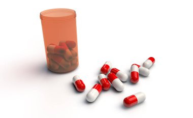 beyaz zemin üzerine dökülen hapları