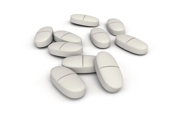 Verschüttete Pillen Auf Weißem Hintergrund lizenzfreie Stockbilder