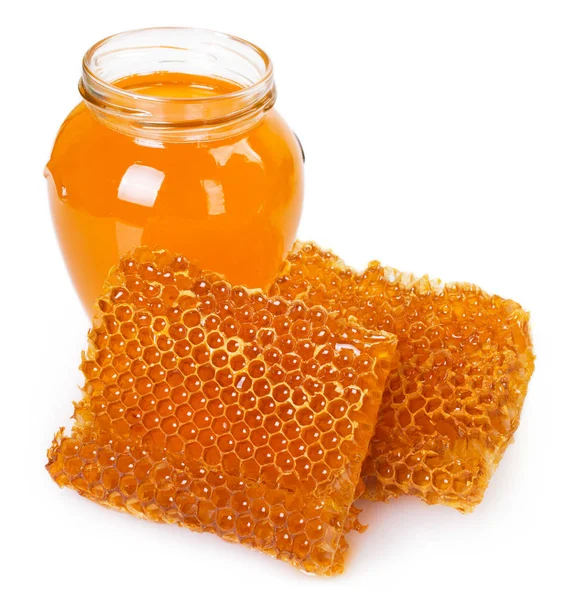 Honung med honeycomb på vit bakgrund — Stockfoto