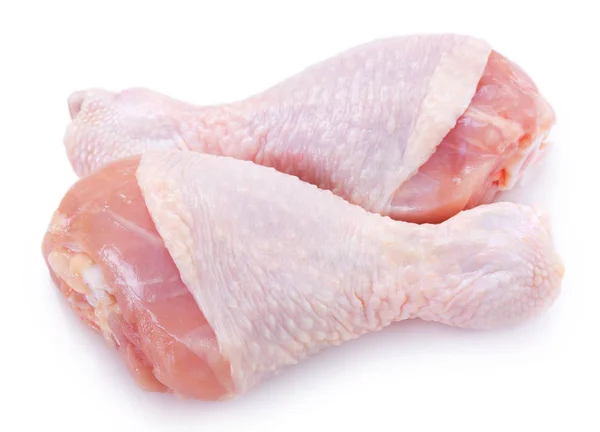 Pernas de frango cru no fundo branco — Fotografia de Stock