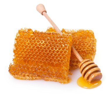 Beyaz arkaplanda bal olan bal peteği