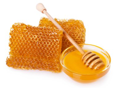 Beyaz arkaplanda bal olan bal peteği