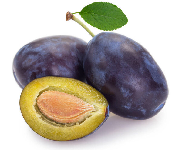 Fresh plums on white background