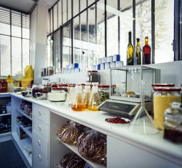 interior of small food lab with electronic balance and glasses