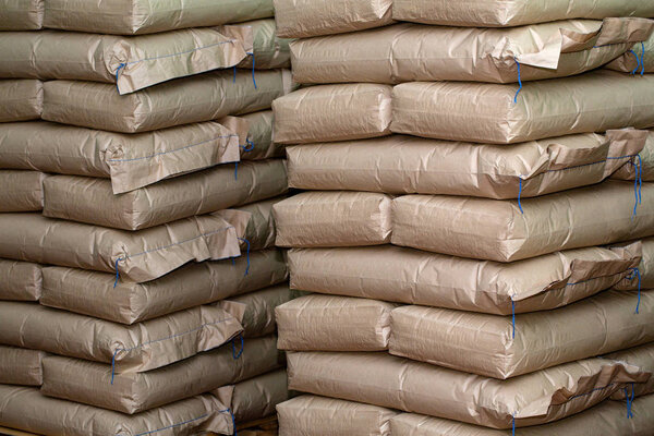 Brown sacks  store in industrial warehouse. Background