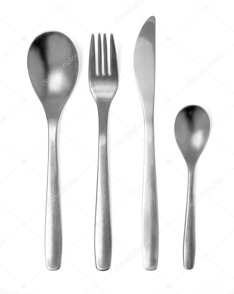 Set of fork, knife and spoons isolated on white with clipping path