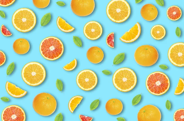 Pattern of an orange citrus slices on bright blue background