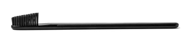 Black toothbrush isolated — Stock Photo, Image