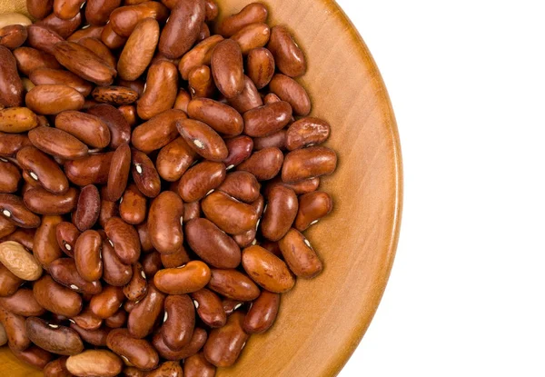 Beans closeup on wooden plate — Stock Photo, Image