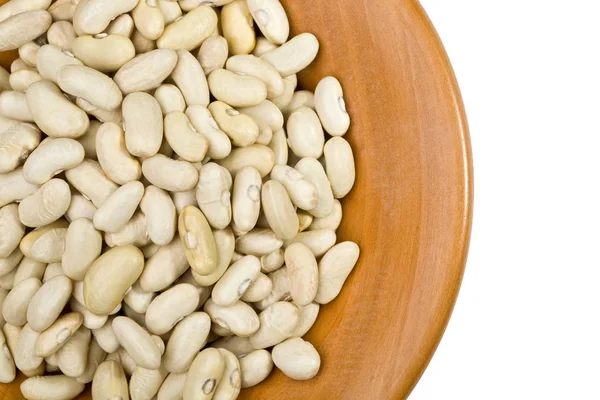 Beans closeup on wooden plate — Stock Photo, Image