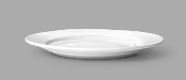 Weißer Teller auf grau — Stockfoto
