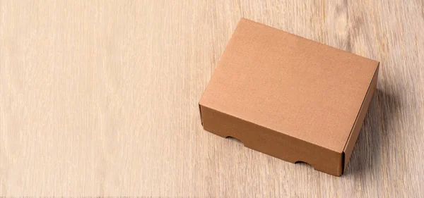 Empty Brown Carton Box Wooden Table — Stock Photo, Image