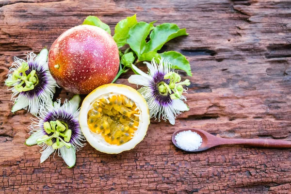 Red passion fruit on an old wood background