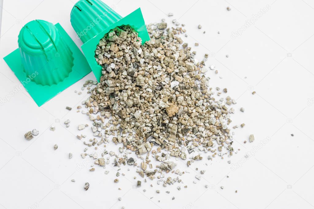 vermiculite with cup of planting set for hydroponics vegetable on white background.
