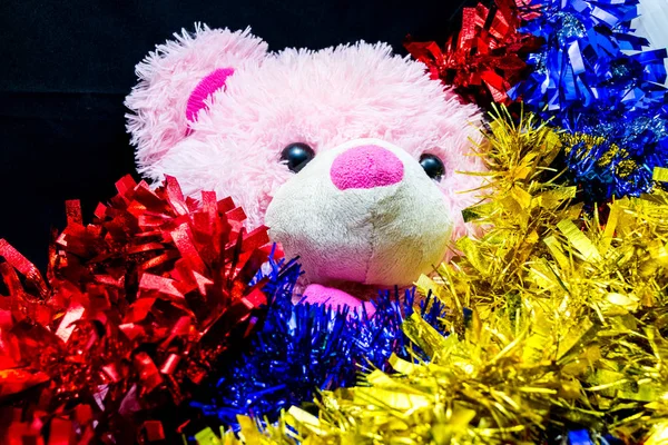 Christmas decoration. Teddy bear with ribbon