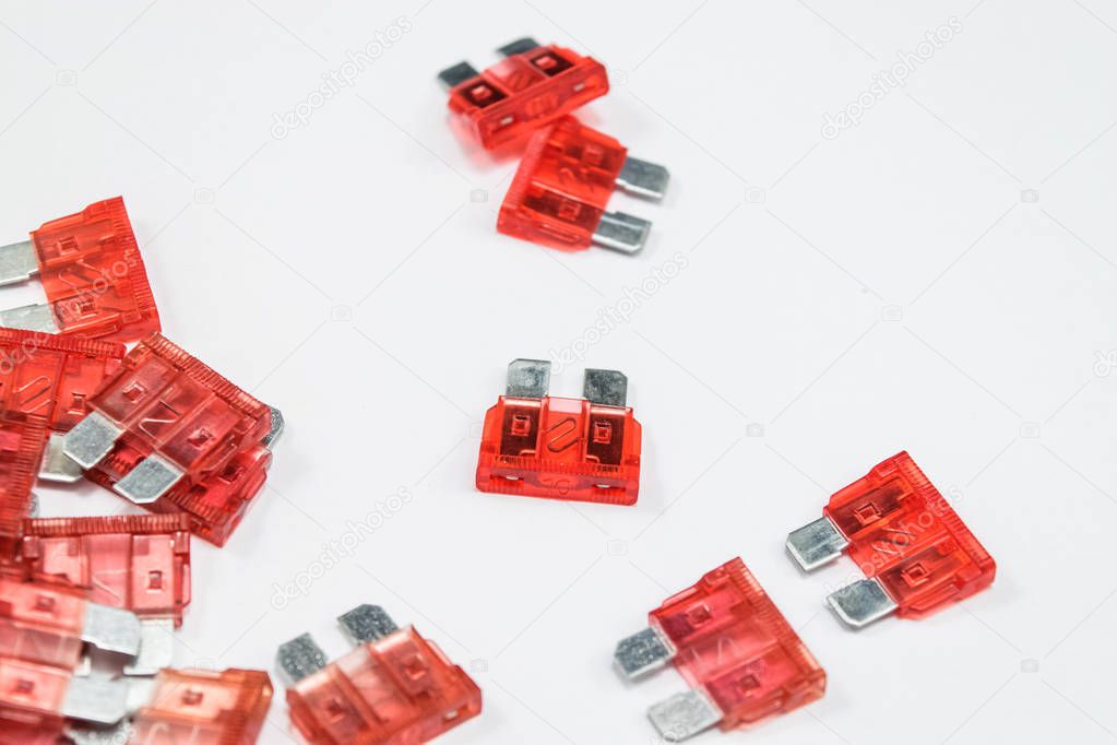 Electrical automotive fuses for car on white background