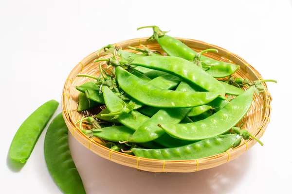 Snow peas on white